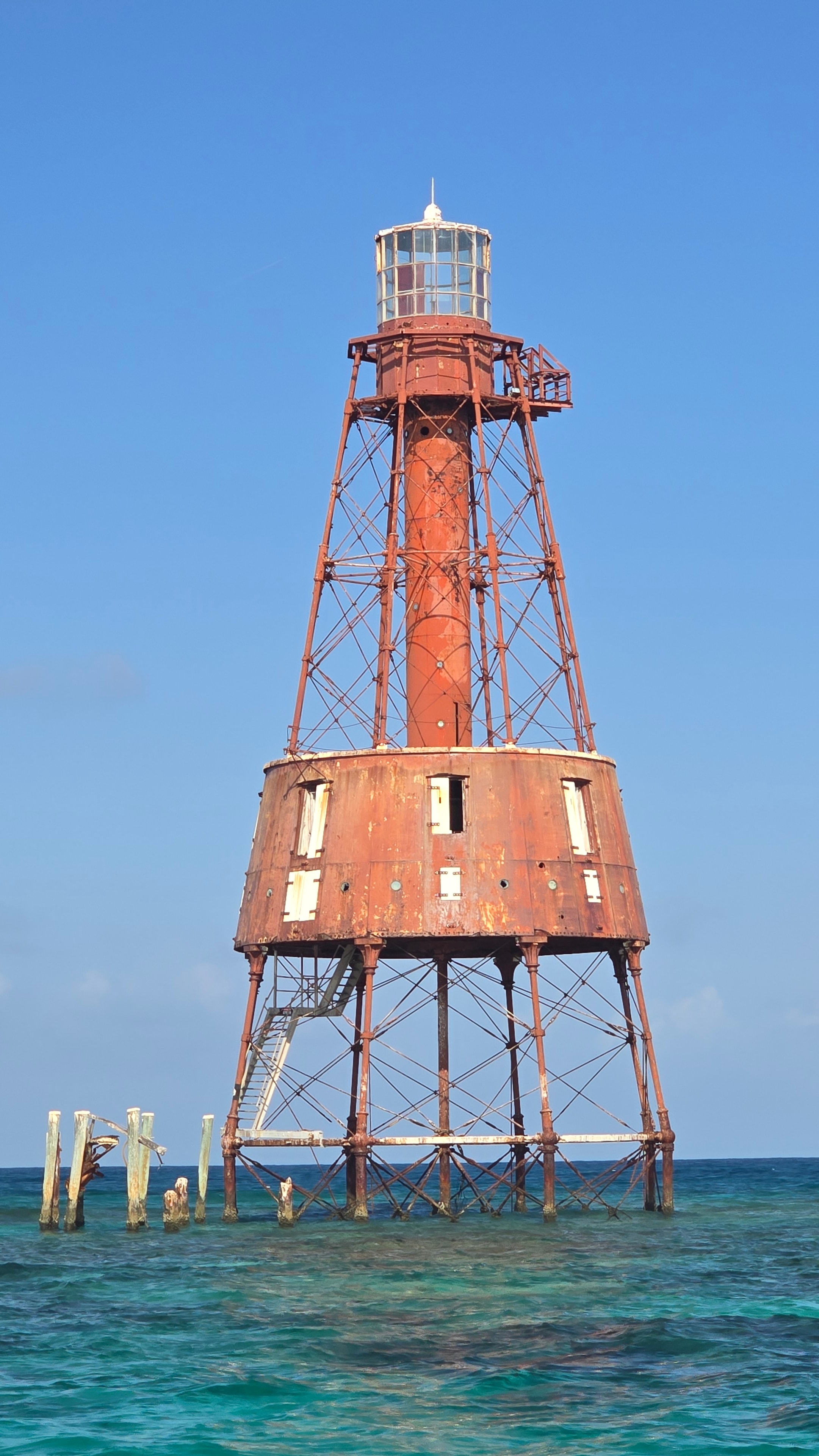 Aerial view of Carysfort Reef Lighthouse rising from the Florida Keys reef